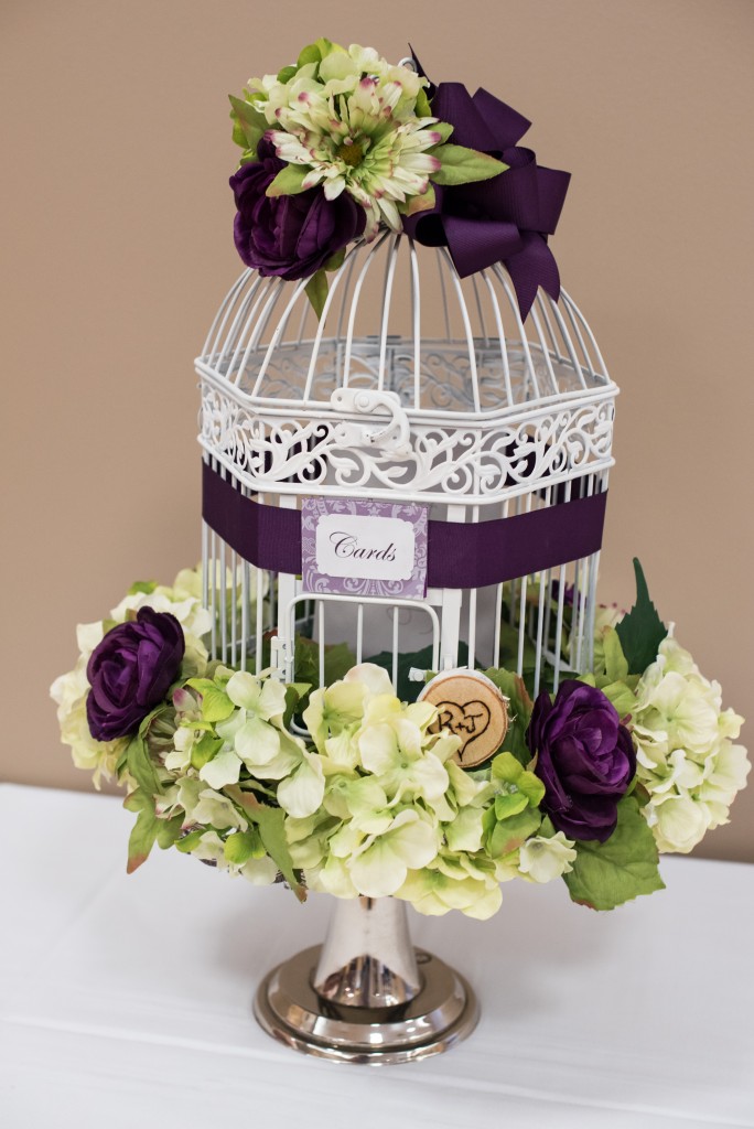 purple wedding color scheme bird cage centerpiece